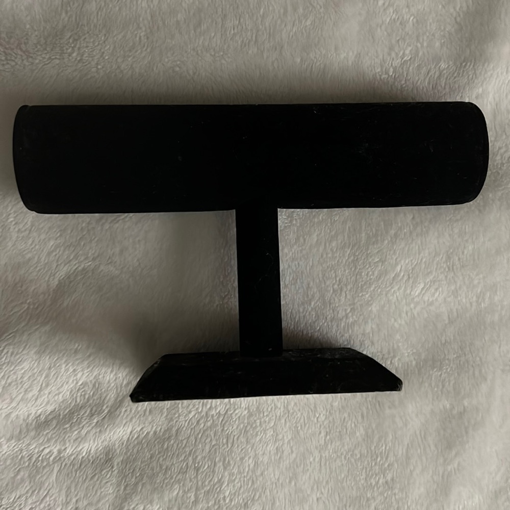 Black velvet Hovering T-Bar Bracelet necklace or watch display.